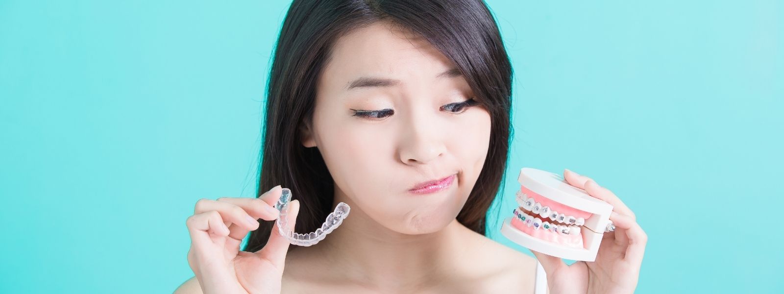 Asian girl confused between dental implants