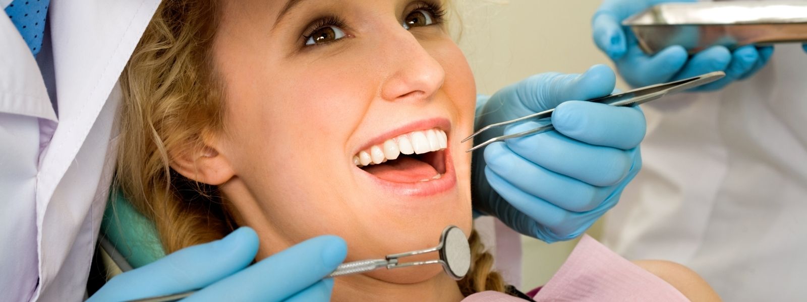 Pretty woman smiling at dentist checkup